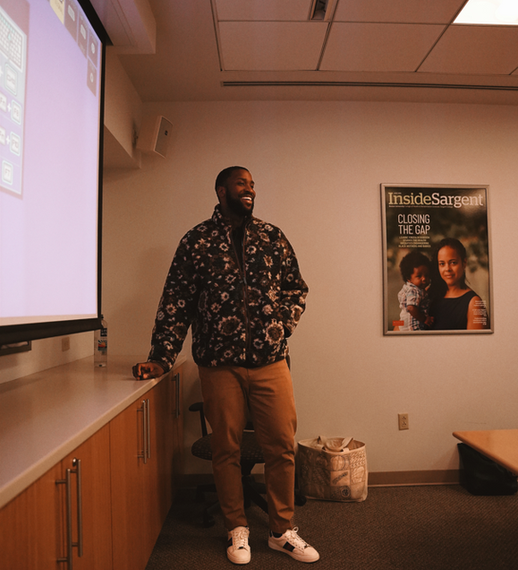 Michael Kidd-Gilchrist talking to students.