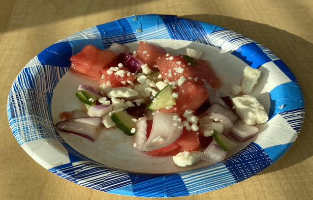 "A close up picture of a plate of Feta watermelon salad with all the ingredients assembled."