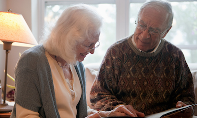 Senior couple looking through photo album