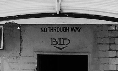 A sign painted above the back door of the mortuary in Lusaka says BID, for "brought in dead."