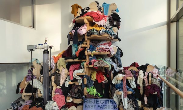 fast fashion protest sculpture-pile of clothes