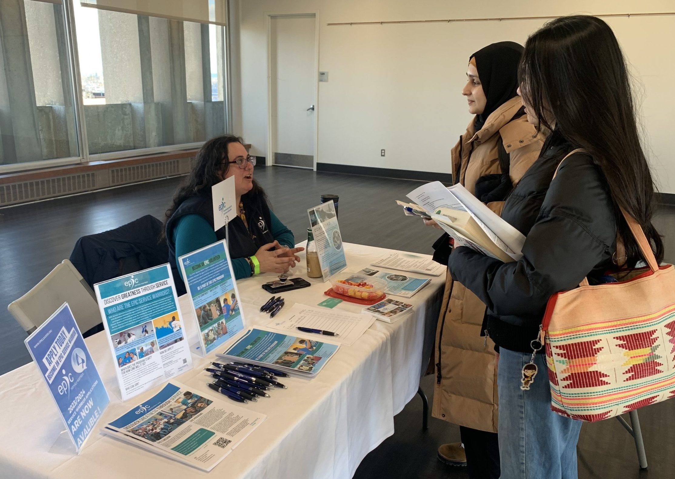 Students speak to staff at local organizations