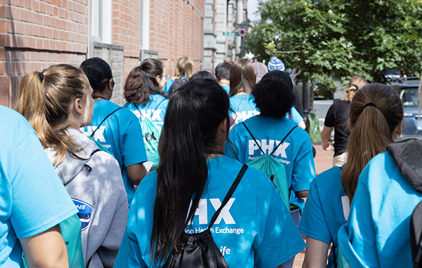 Population Health Experience students walk down the street in Boston