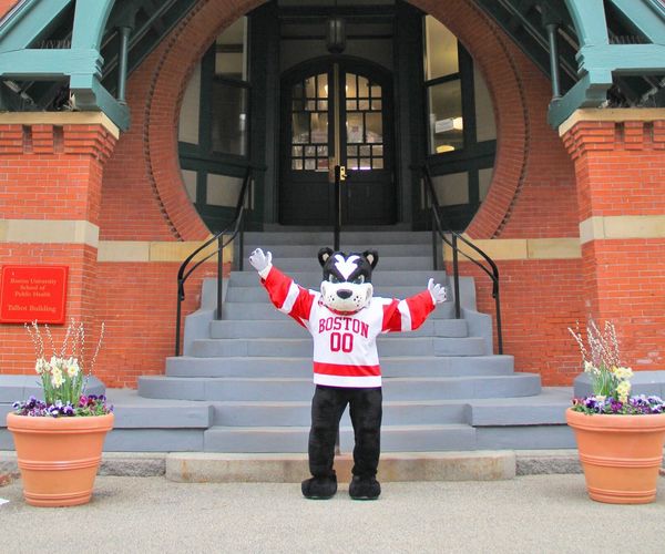 BU mascot Rhett stands in front of the Talbot building steps