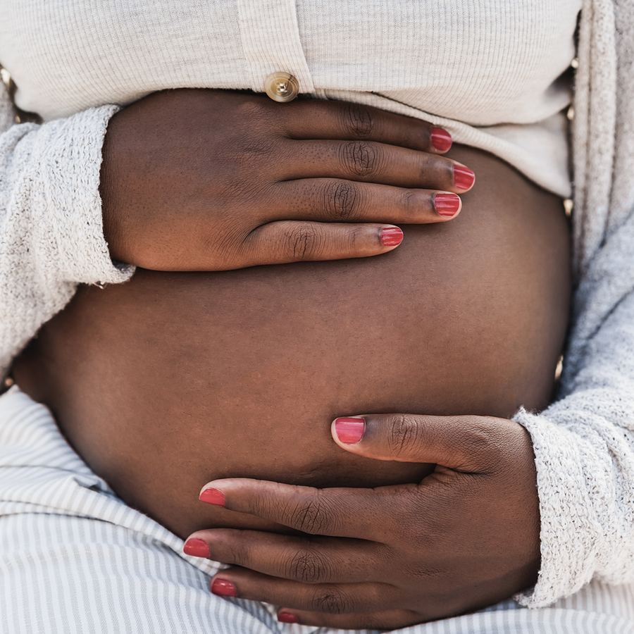 Close up of pregnant belly of a black woman