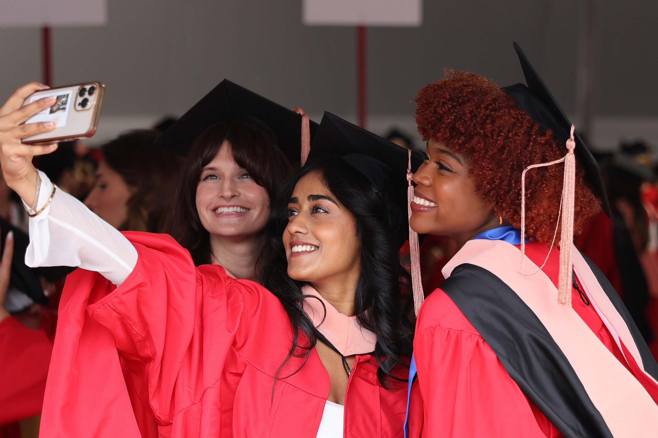 Three graduates take selfie at SPH convocation 2024