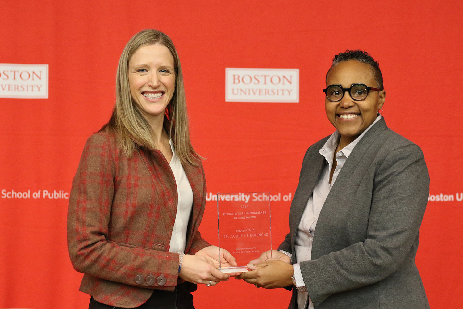 Scarlett Bellamy presents Audrey Hendricks with the 2024 Biostatistics Distinguished Alumni Award