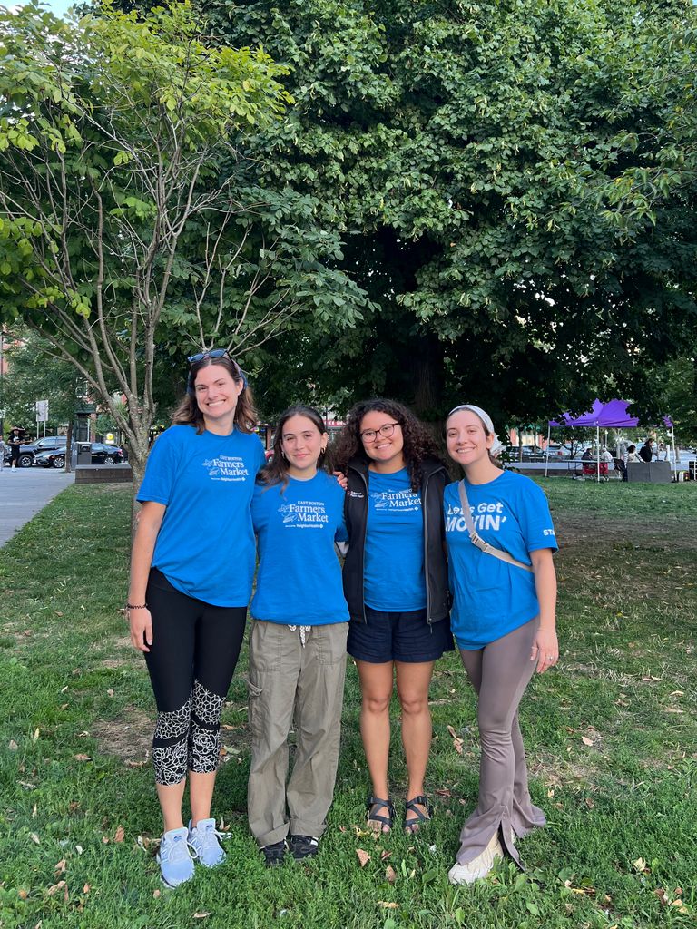 Michelle Veras with colleagues from NeighborHealth after one of their summer famers markets. From left to right: Kelsey Briggs, coordinator of food access initiatives and market manager of the East Boston Farmers Market; Madeline Fabrey, a fellow intern; Veras, and Michelle Toth Castillo, another fellow intern.
