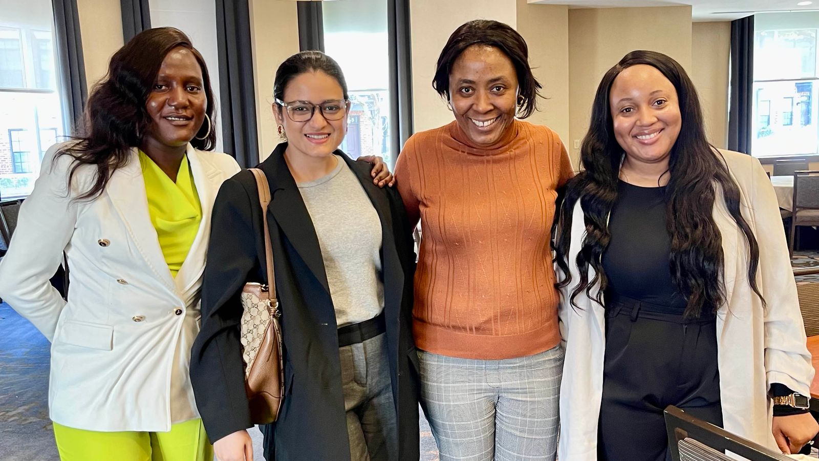 BUSSW PhD student Emily Lamunu (far left) with workshop participants and an APHA staff member at the 2024 APHA Junior Investigator Writing Workshop
