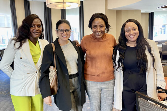 BUSSW PhD student Emily Lamunu (far left) with workshop participants and an APHA staff member at the 2024 APHA Junior Investigator Writing Workshop
