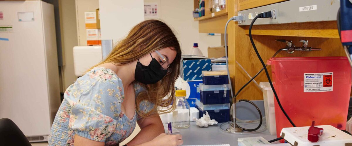 A Boston University student in the lab.