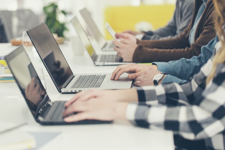 Multiple people using laptops