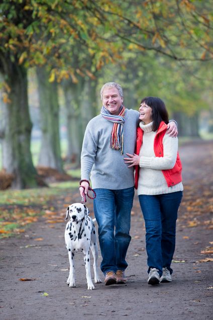 Mature Couple Walking the Dog