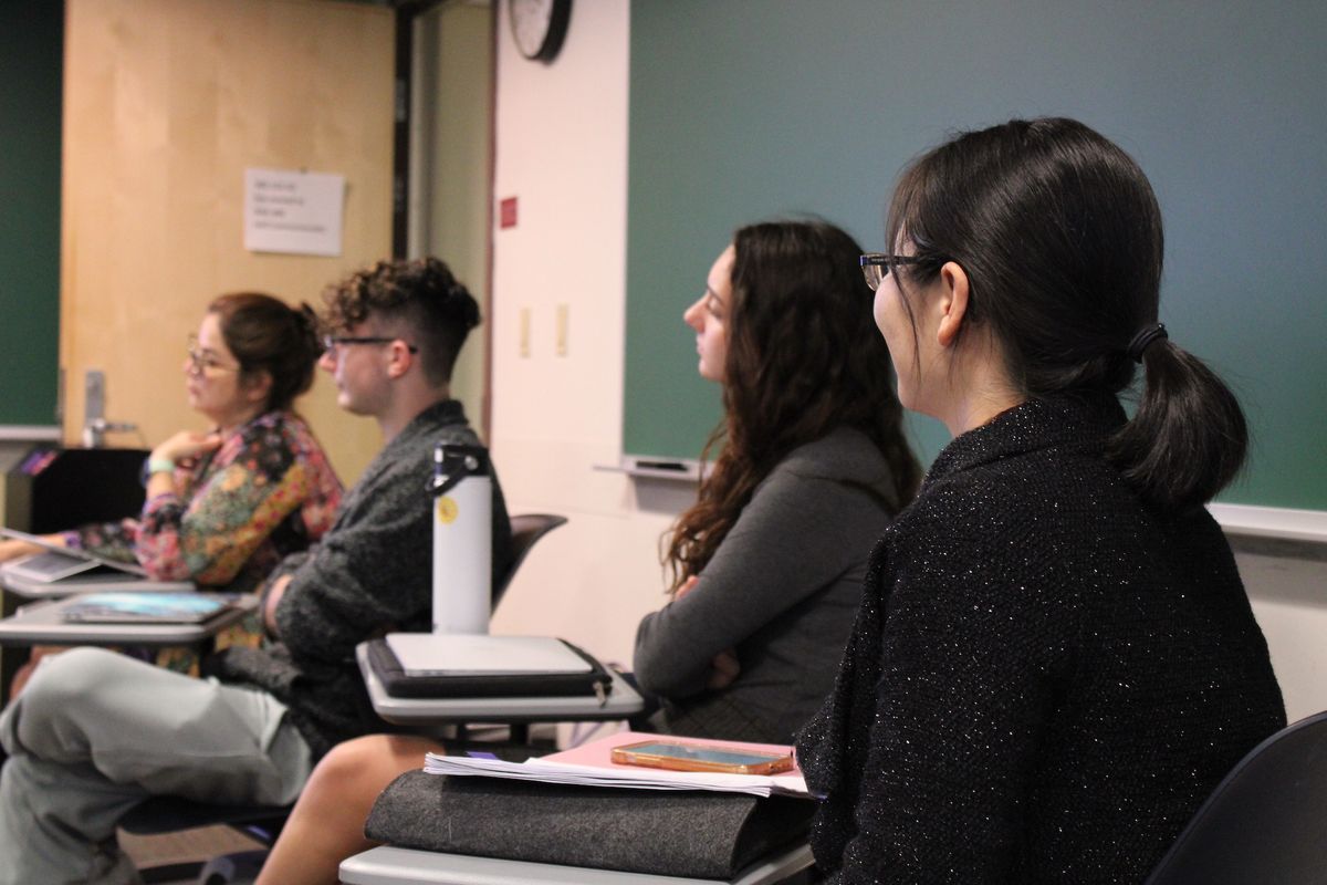 students looking towards chalk board in world language class