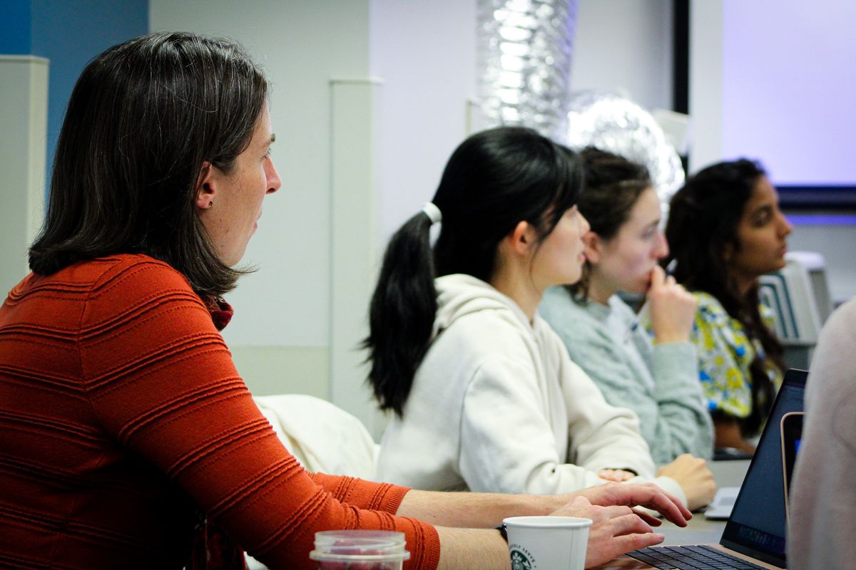 Graduate students sitting in class