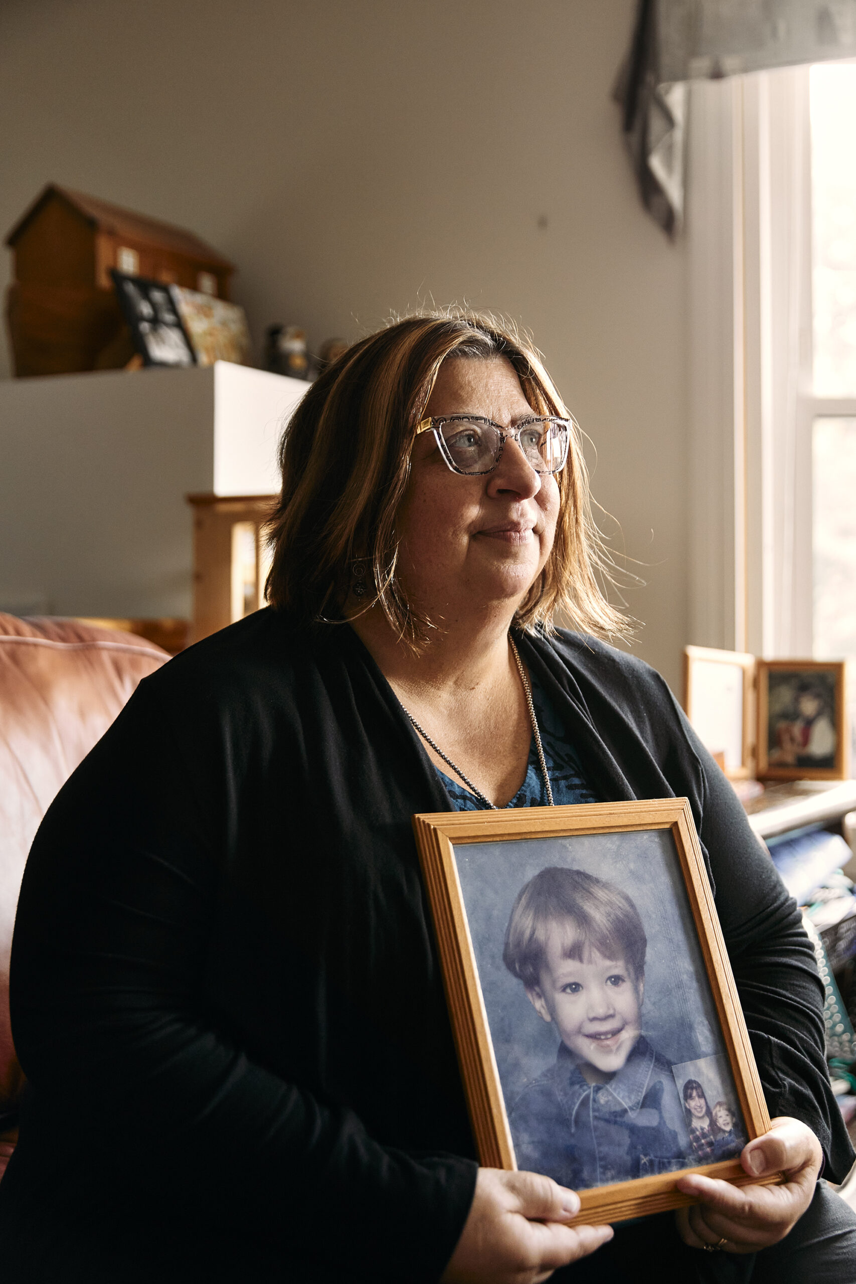 Tanya Lord holding photo of son