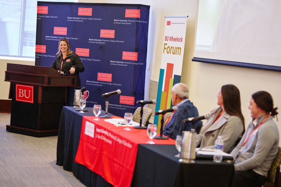 Carly Block on left hand side moderating panel during the 2024 BU Wheelock Forum